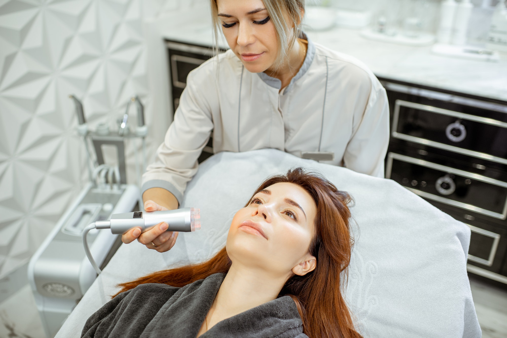 cosmetologist-making-facial-treatment-to-a-woman.jpg cosmetologist-making-facial-treatment-to-a-woman.jpg